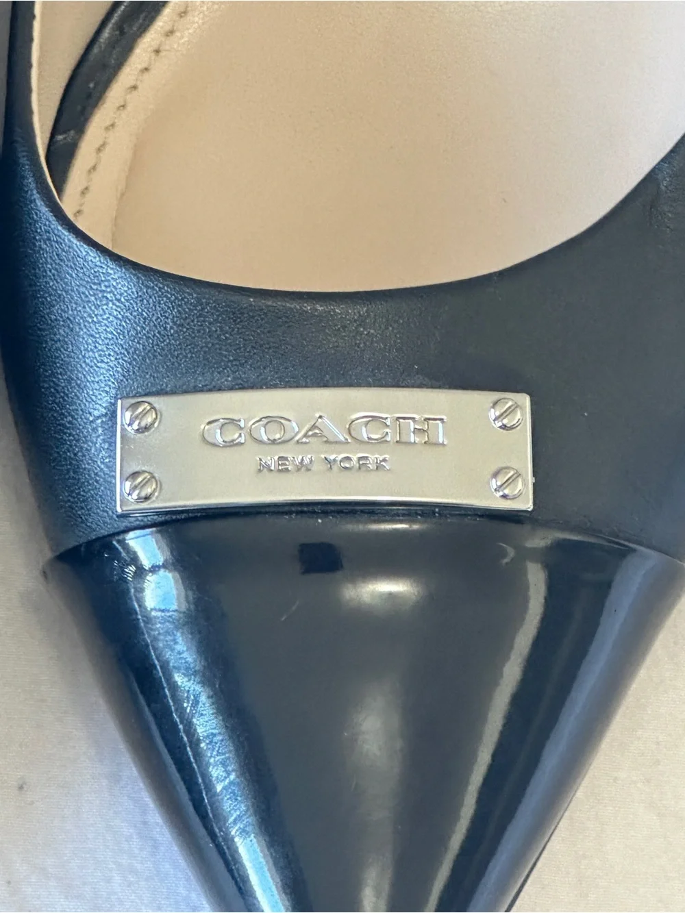 Coach Black Pointed-Toe Leather Flats with Logo Cap